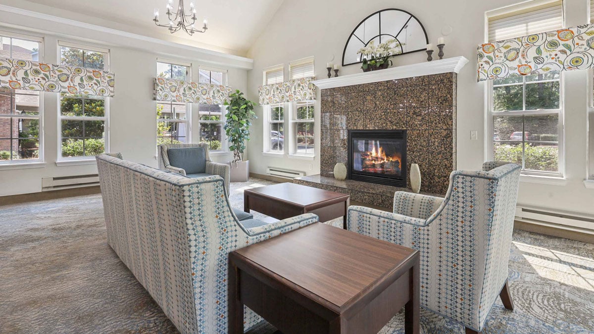 A cozy fireplace lounge at Summerville Estates
